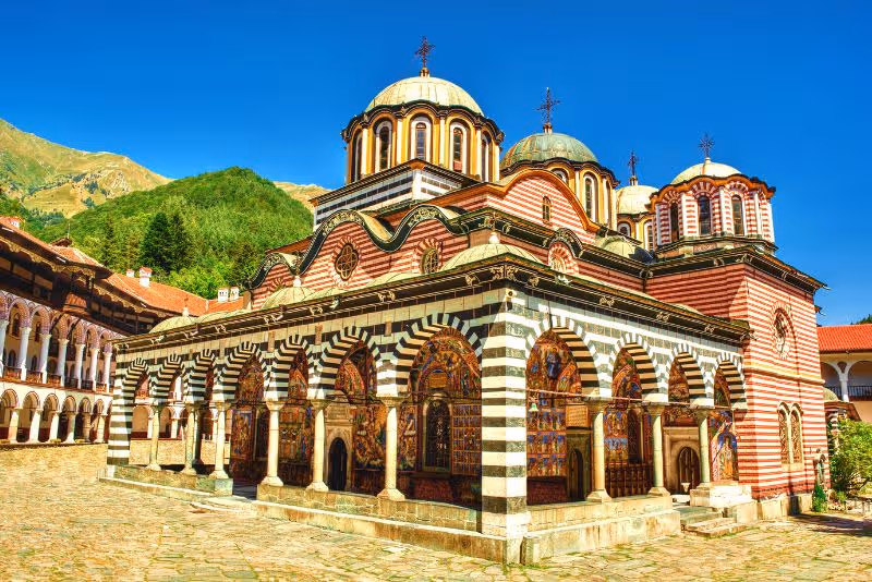 The iconic striped balconies and courtyard of Rila Monastery